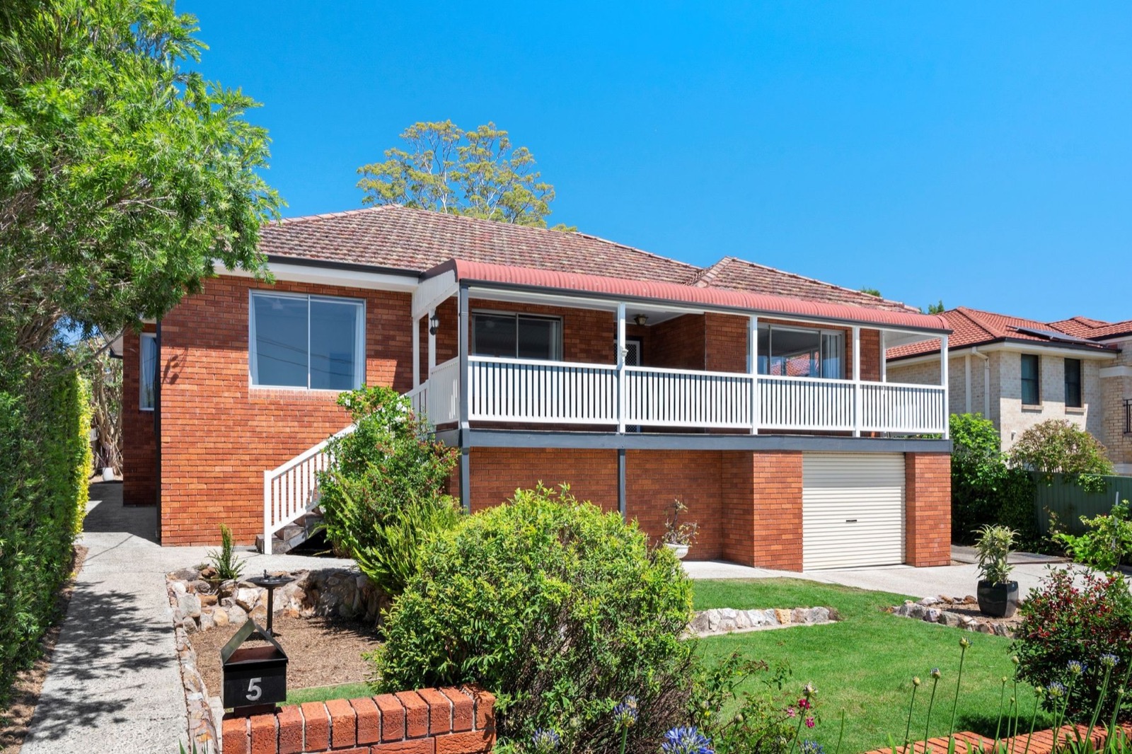 Exterior painting of a brick home