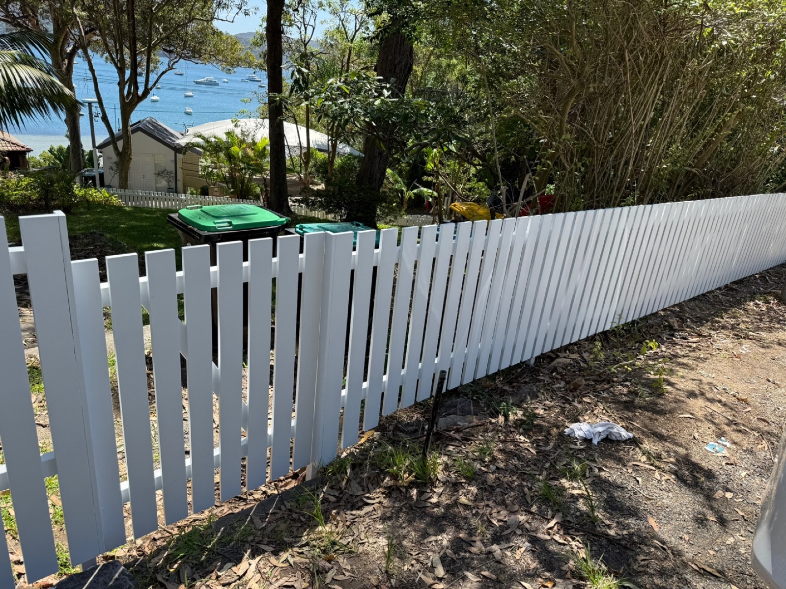 Freshly painted white picket fence